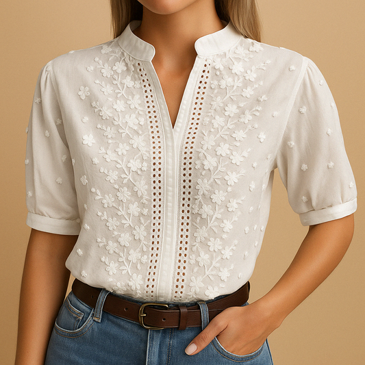 White blouse for women featuring a tailored fit, classic collar, and button closure. Ideal for work, leisure, or evening wear.