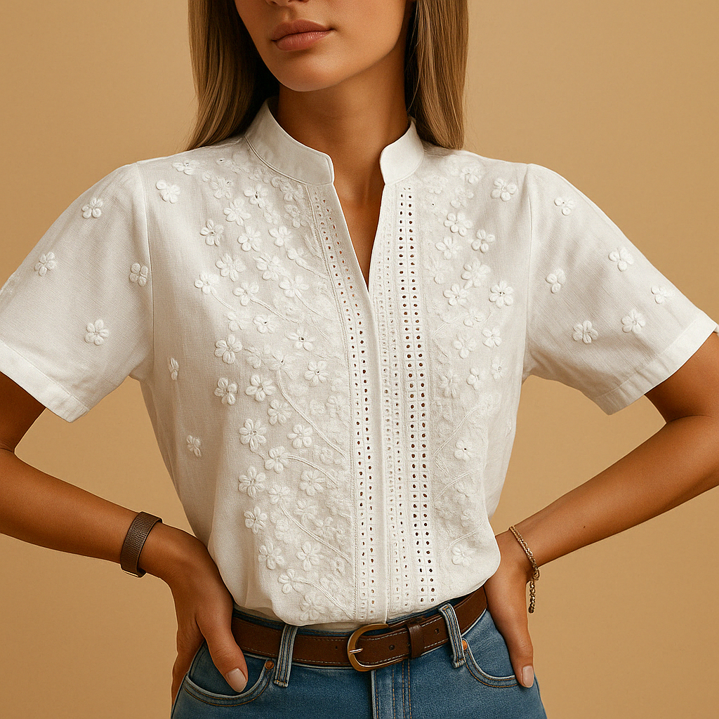 White blouse for women featuring a tailored fit, classic collar, and button closure. Ideal for work, leisure, or evening wear.