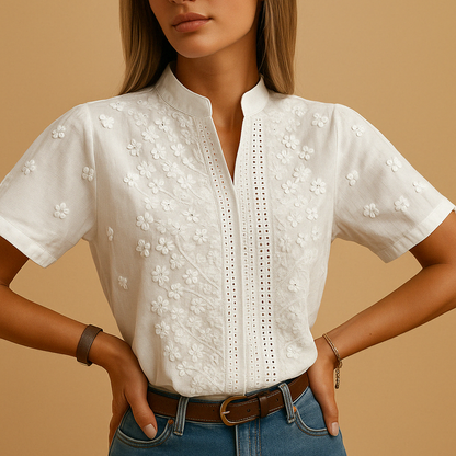 White blouse for women featuring a tailored fit, classic collar, and button closure. Ideal for work, leisure, or evening wear.