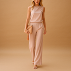 Elegant wide leg jumpsuit for women named Harper with round neckline, mid-waist fit, and flowing silhouette, available in pink, red, blue, and black.