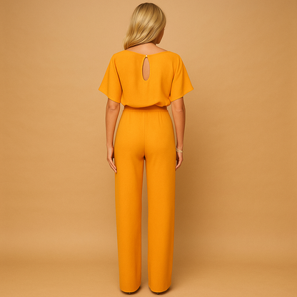 High waist jumpsuit for women named Naomi with lace-up detail, flattering fit, and flowing fabric in black, navy blue, yellow, and apricot.