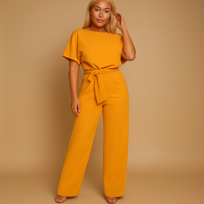 High waist jumpsuit for women named Naomi with lace-up detail, flattering fit, and flowing fabric in black, navy blue, yellow, and apricot.