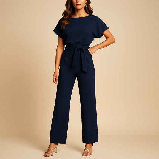 High waist jumpsuit for women named Naomi with lace-up detail, flattering fit, and flowing fabric in black, navy blue, yellow, and apricot.