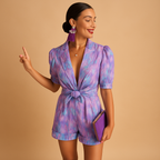Short summer jumpsuit for women named Layla with belted waist and vibrant print, ideal for warm days, casual outings, and summer evenings.