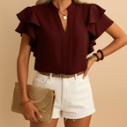 Women’s sleeveless blouse named Amelia with a tailored fit and lightweight fabric. Perfect for work, casual outings, and elegant everyday wear.